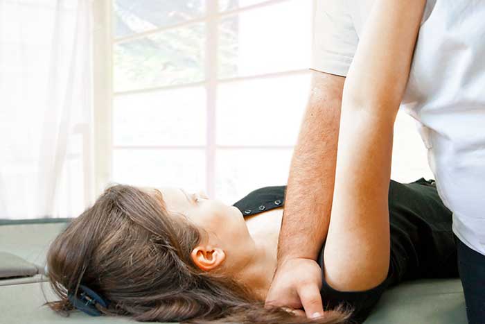 Women receiving active release technique therapy