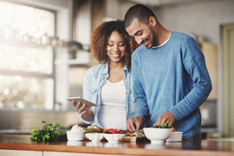 A couple preparing the meal