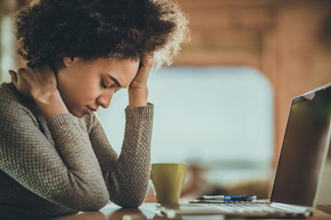 Woman stressed while working on the computer