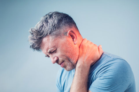 A man suffering from neck pain