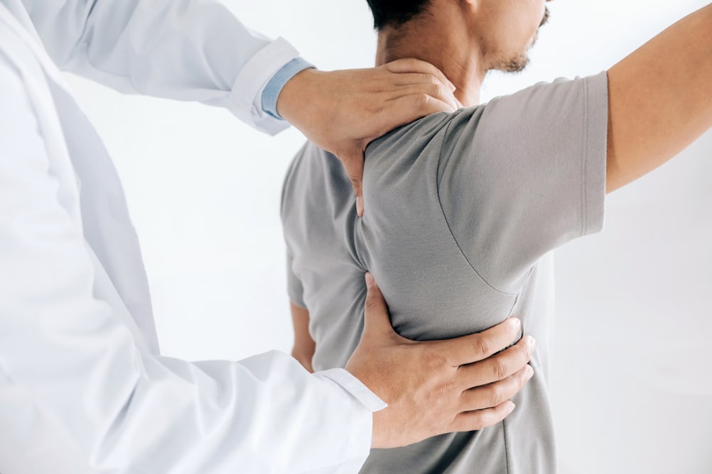 Doctor giving massage for shoulder pain