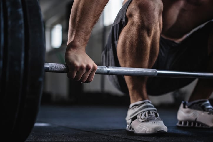 Athlete lifting weights in Maryland gym