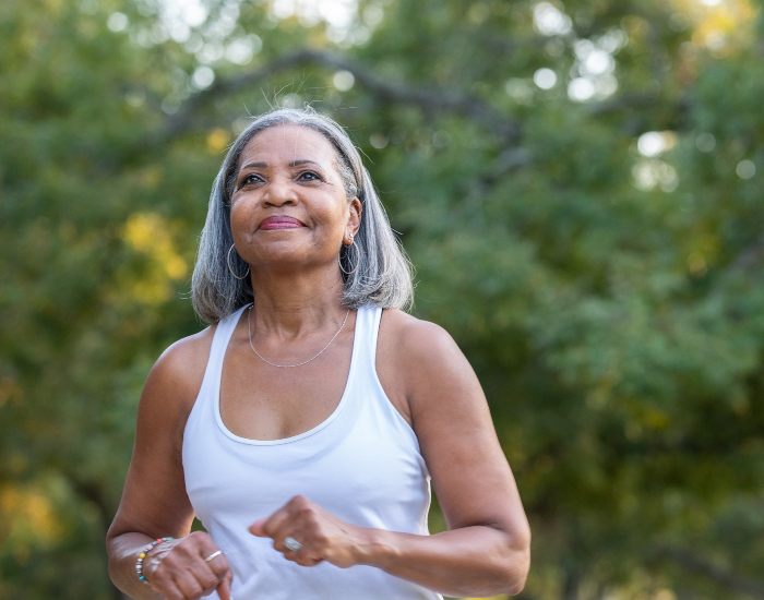 Older woman jogging outside in Millersville, MD