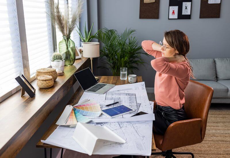 Business woman suffering from neckache