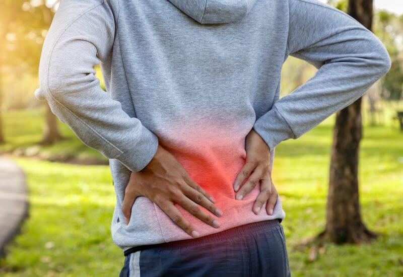 Man on walk with back pain