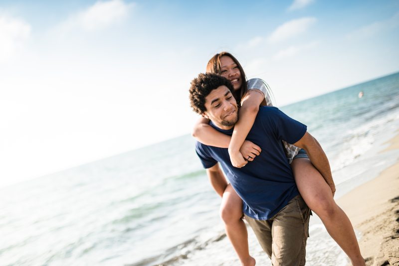 Woman piggyback riding on male friend